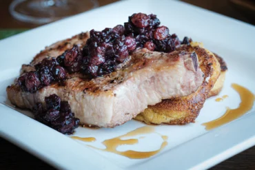 Wild Blueberry Mostarda made with Wyman's wild blueberries served over New England Johnnycakes