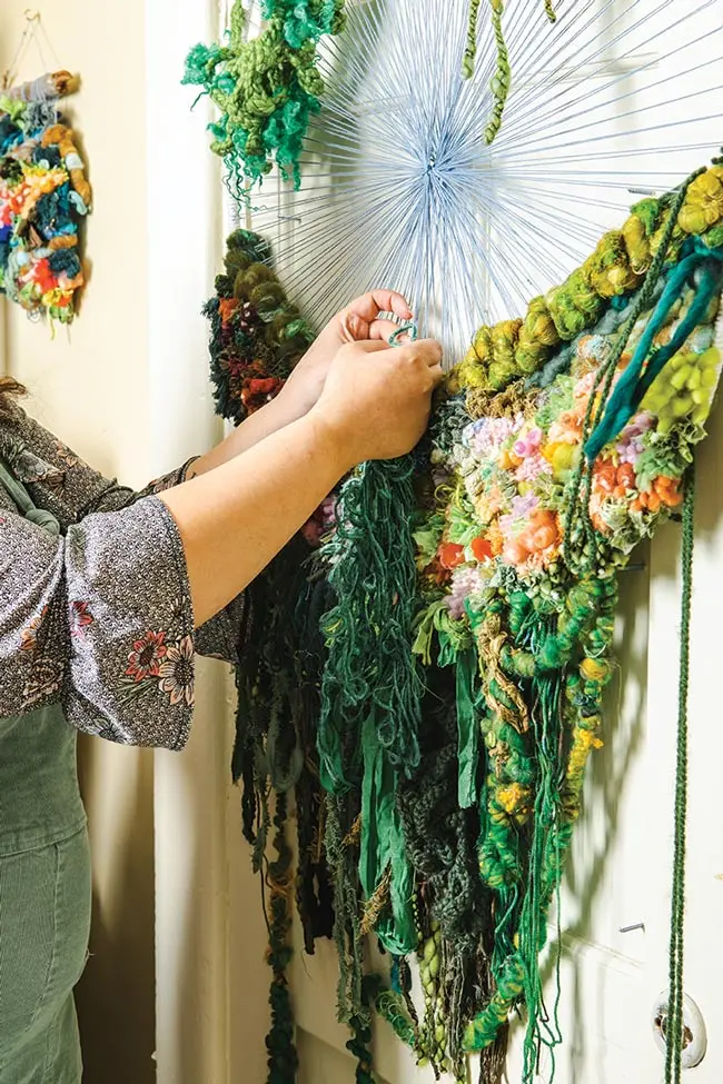 A moss-like wall weaving by Halley Phillips