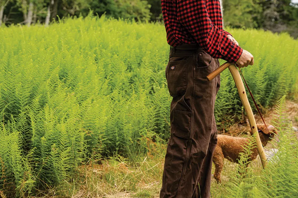 man holding a Greyfeather Woodcraft walking stick