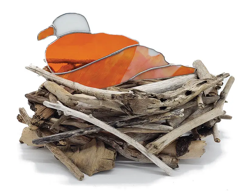 stained-glass seagull in a nest