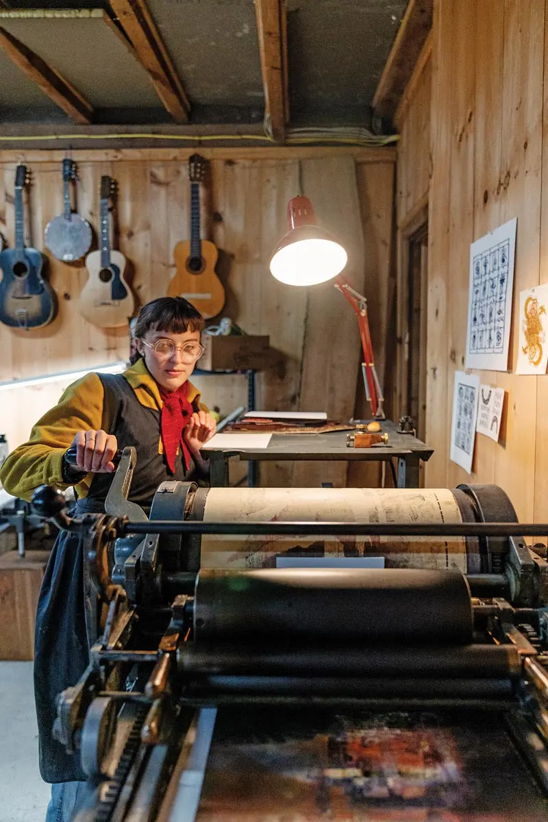 Printmaker Addie Best at her 1946 Vandercook press