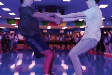 two people roller skating at Happy Wheels