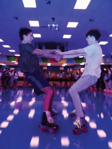two people roller skating at Happy Wheels