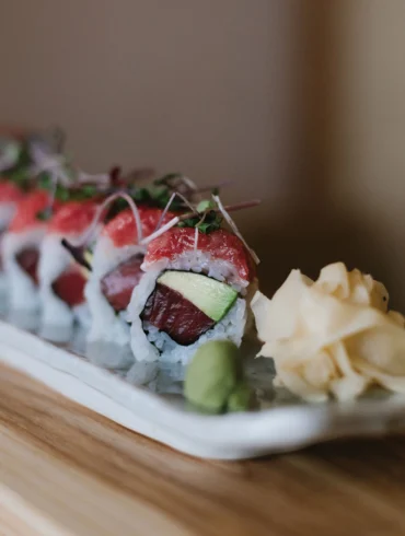 Miyake’s Super Toro Roll filled with tuna and avocado and topped with diced toro, scallions, and microgreens.