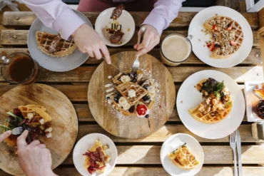 Table full of waffles from Peace, Love & Waffles