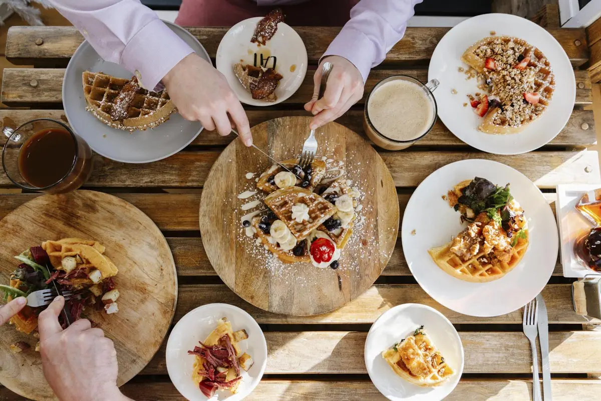 Table full of waffles from Peace, Love & Waffles