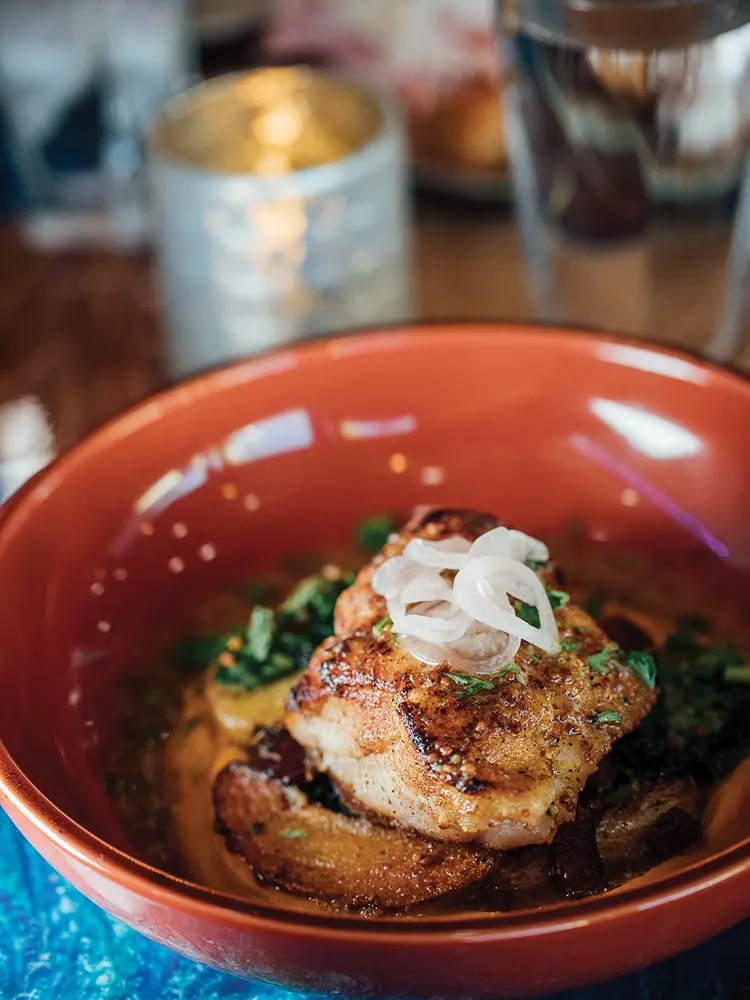 Monkfish with confit potatoes, lardon, spinach, buttercup-squash puree, and brown-butter sauce