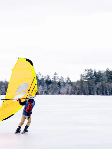 Tim Hynd and his kitewing skating on Compass Pond, near Baxter State Park