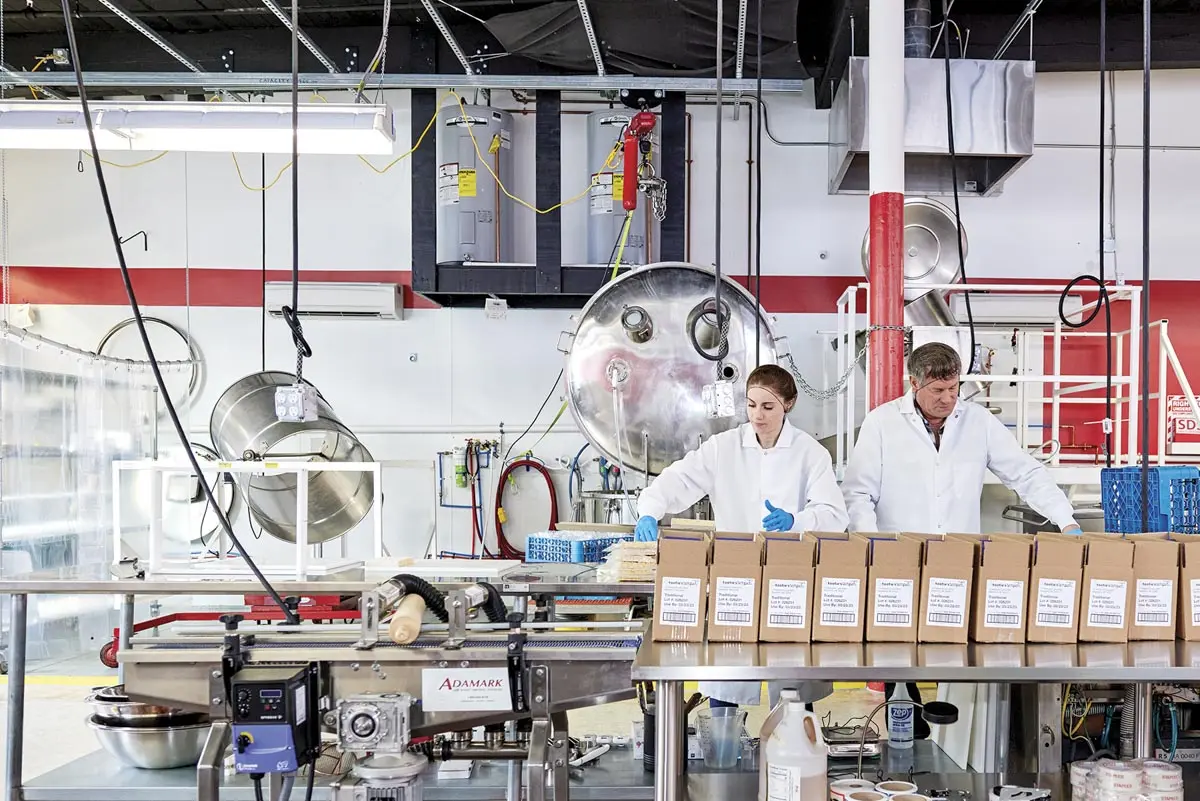 Kate Musser and Michael LaCharite on the production line at Tootie's Tempeh in Biddeford, Maine