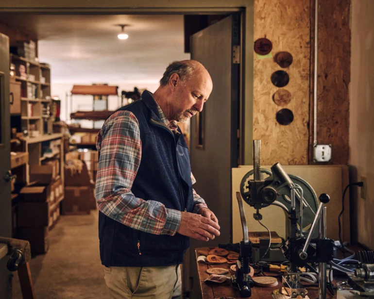 Michael Lyons, founder of Rogue Industries, in his solar-powered Standish workshop