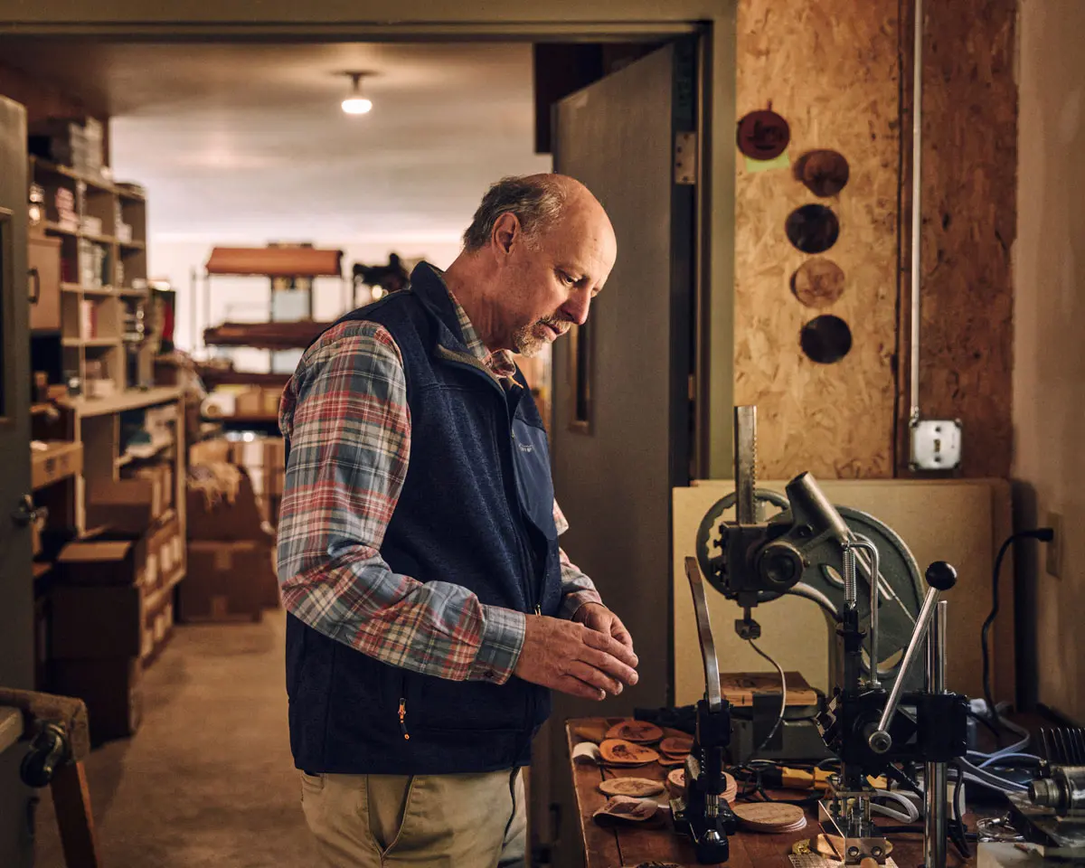 Michael Lyons, founder of Rogue Industries, in his solar-powered Standish workshop