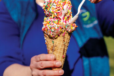 two scoops with rainbow sprinkles on a cone from Gifford's ice cream