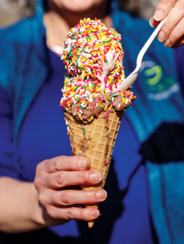 two scoops with rainbow sprinkles on a cone from Gifford's ice cream