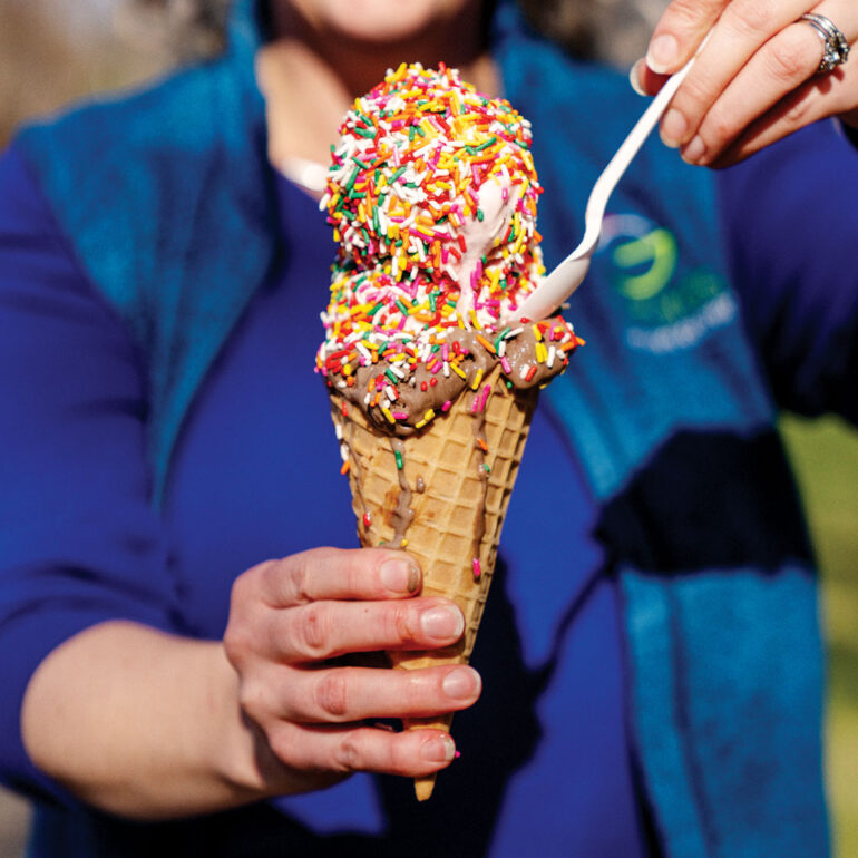 two scoops with rainbow sprinkles on a cone from Gifford's ice cream