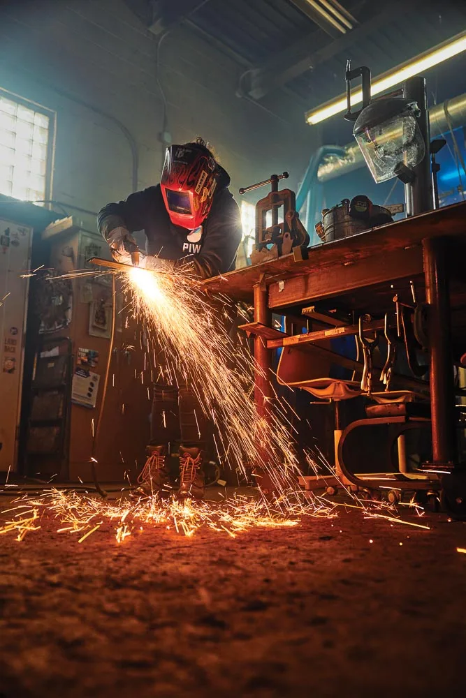 Jo Remillard demonstrating a skill at People's Inclusive Welding