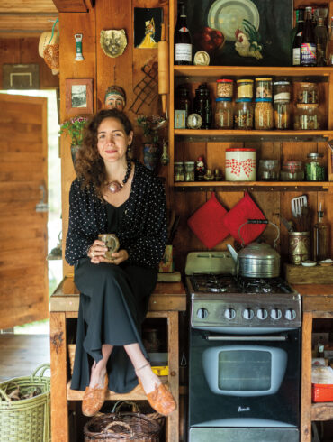 Danielle Filosa sits in her rustic kitchen