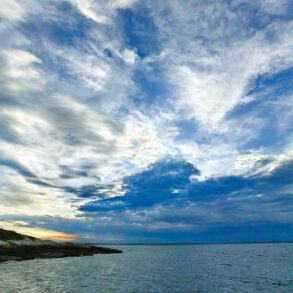 an approaching storm encroaches the Deer Island Thorofare Light, on Mark Island, off Stonington.