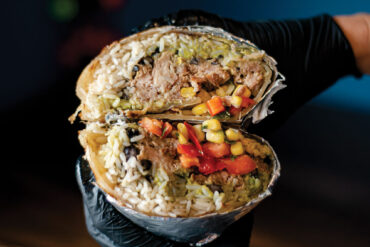 burrito stuffed with smoked meat, rice, black beans, corn, peppers and salsa from Bub’s Burritos