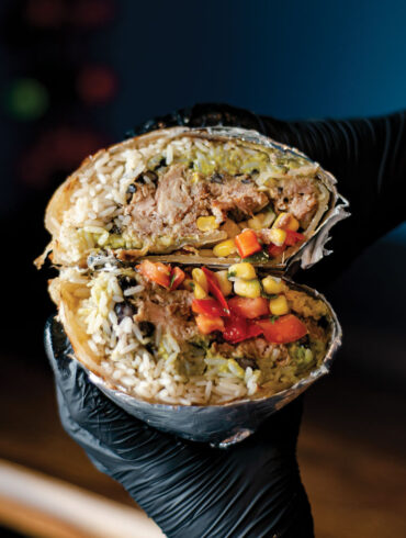 burrito stuffed with smoked meat, rice, black beans, corn, peppers and salsa from Bub’s Burritos
