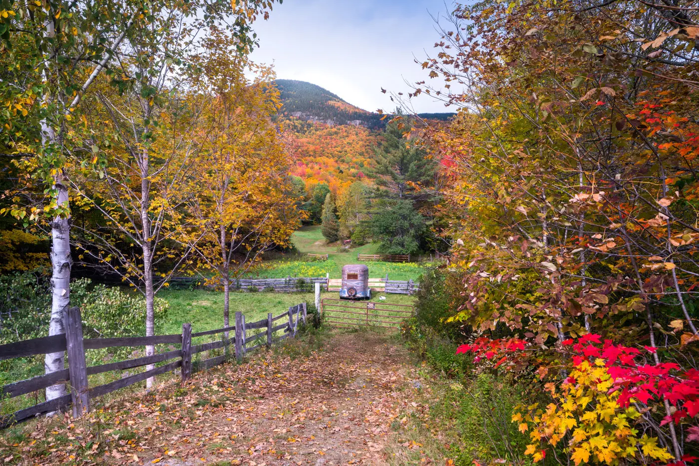 A farm road in Grafton Notch, with Mount Hittie looking down.