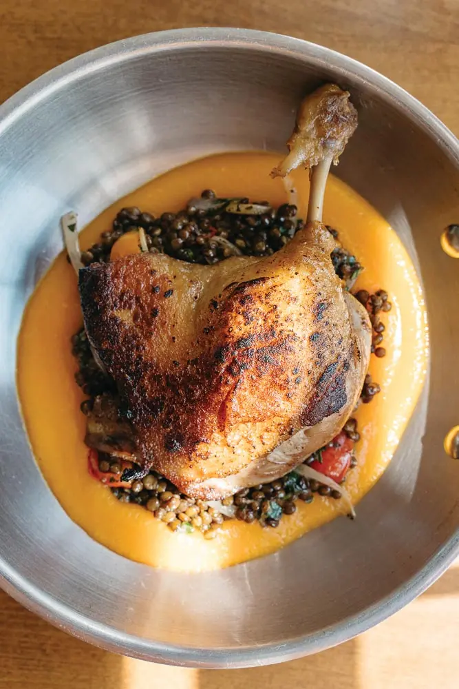 duck confit with butternut-squash puree and beluga lentils