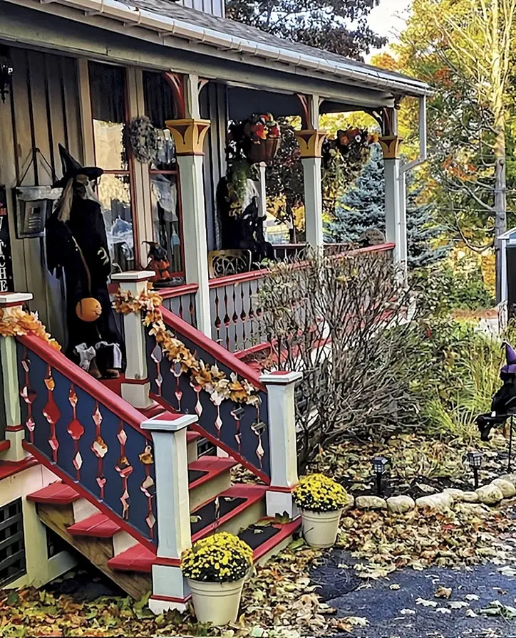 Migdalia Mass decorates the deck area of her Gothic Revival in Auburn