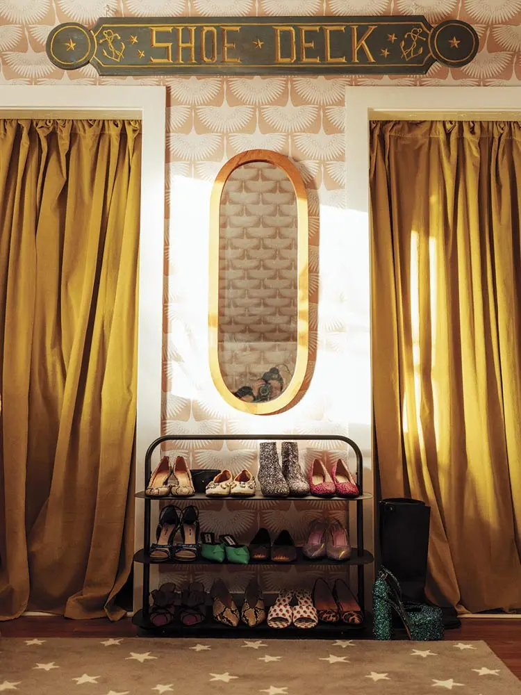 West Elm velvet curtains hang in front of the closests in Riley's room