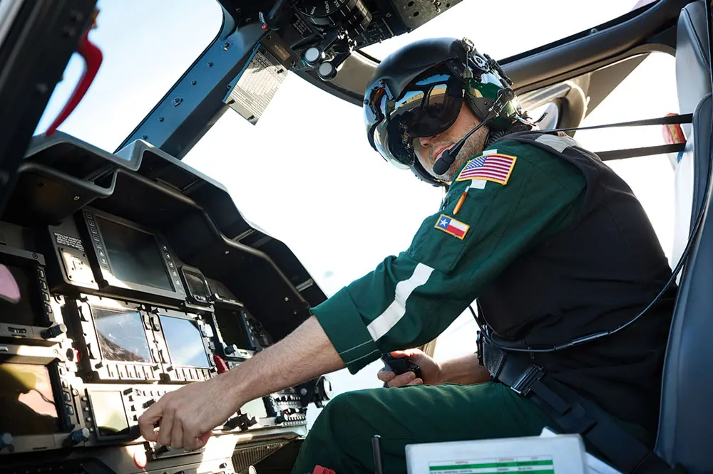 a LifeFlight of Maine pilot at the controls in the helicopter