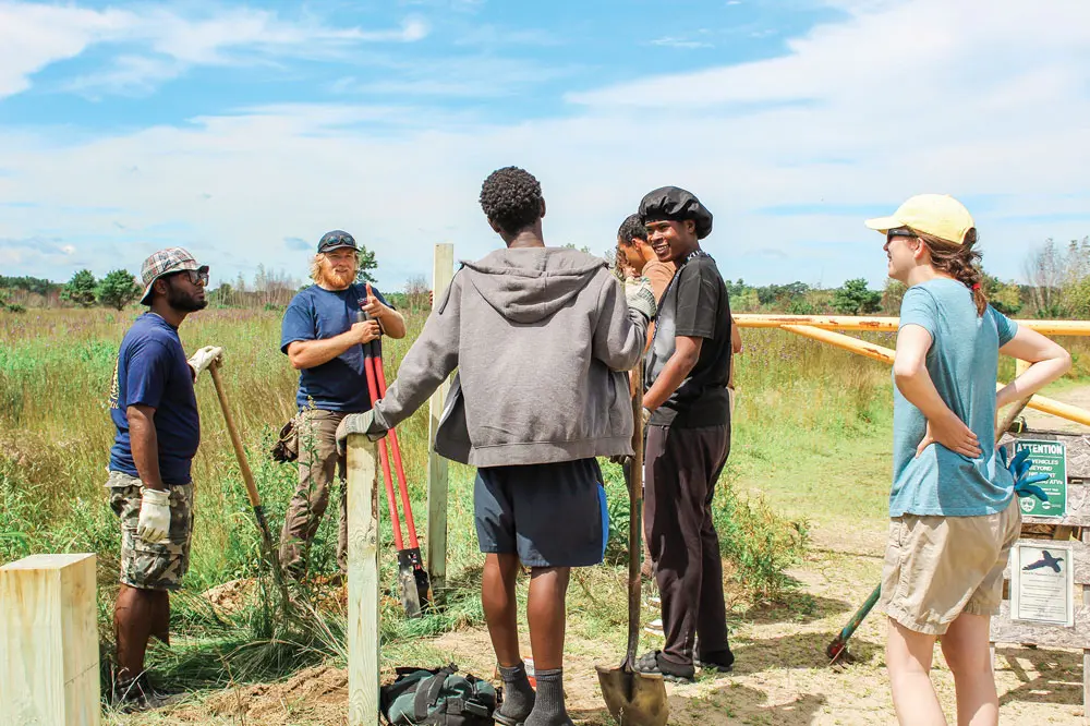 Members of the Tree Street Youth community and The Nature Conservancy in Maine staff recently worked together on a stewardship project at the Kennebunk Plains Preserve.