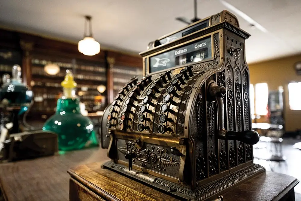 an old cash register is among the salvaged items on display at the LaVerdiere Apothecary