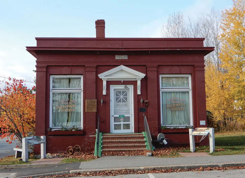 The Rangeley Lakes Region Historical Society sits in what was the Rangeley Trust Company Building, a Classical Revival designed by Lewiston architect William R. Miller