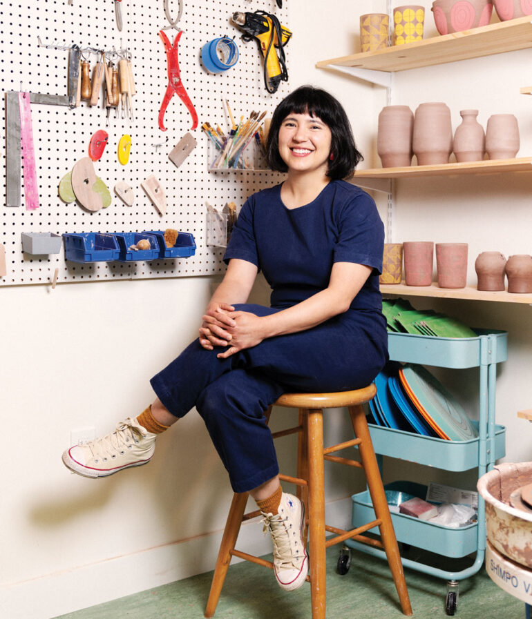 ceramicist Alice Nasto sitting in her Breman studio