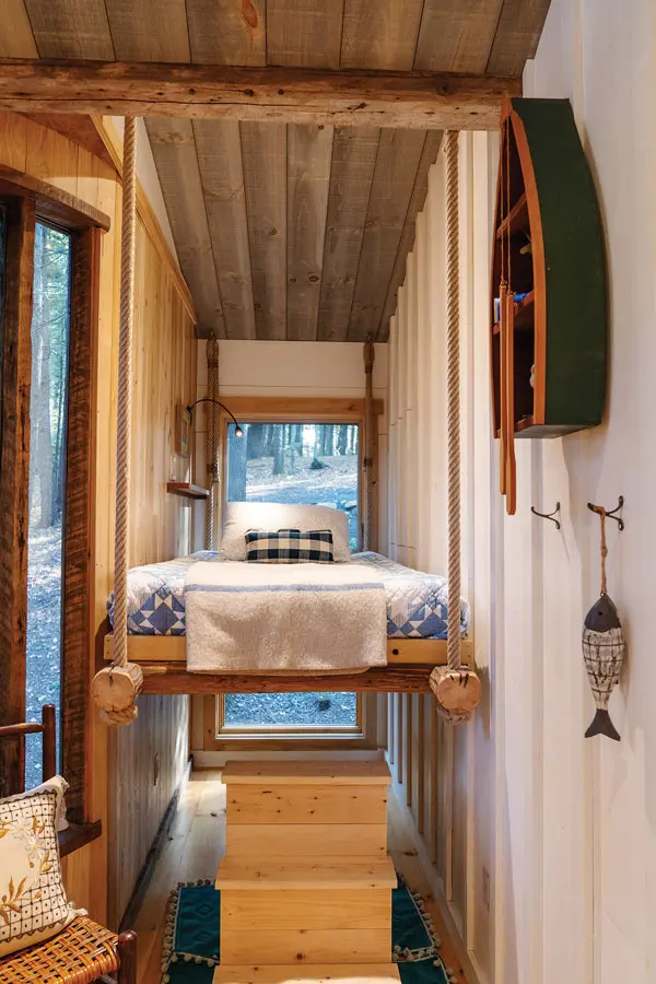 one of the twin bed sleeping spaces in Lindy Snider's latest tree-house on Cobbosseecontee Lake in Monmouth, Maine