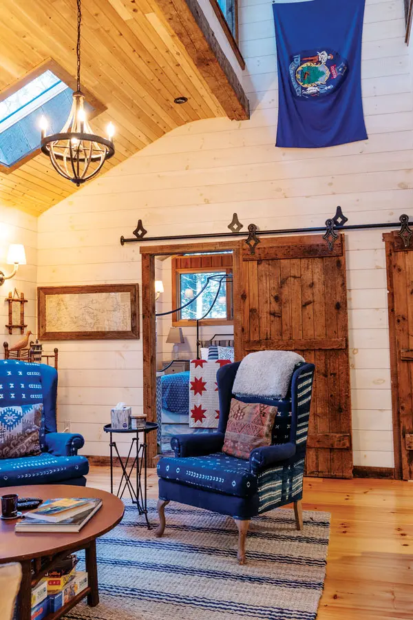 the living room in Lindy Snider's latest tree-house on Cobbosseecontee Lake in Monmouth, Maine