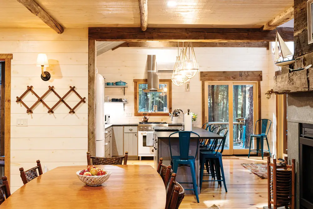 kitchen and dining room in Lindy Snider's latest tree-house on Cobbosseecontee Lake in Monmouth, Maine