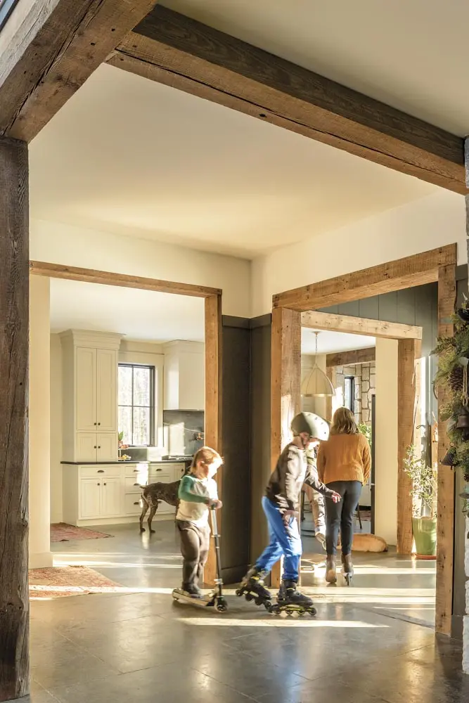 kids roller skating and scootering on the home's concrete floors
