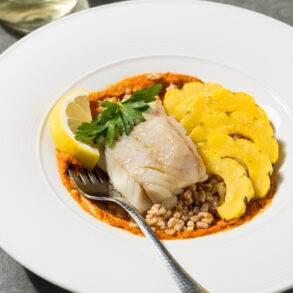 Pollock with Farro, Delicata Squash, and Romesco