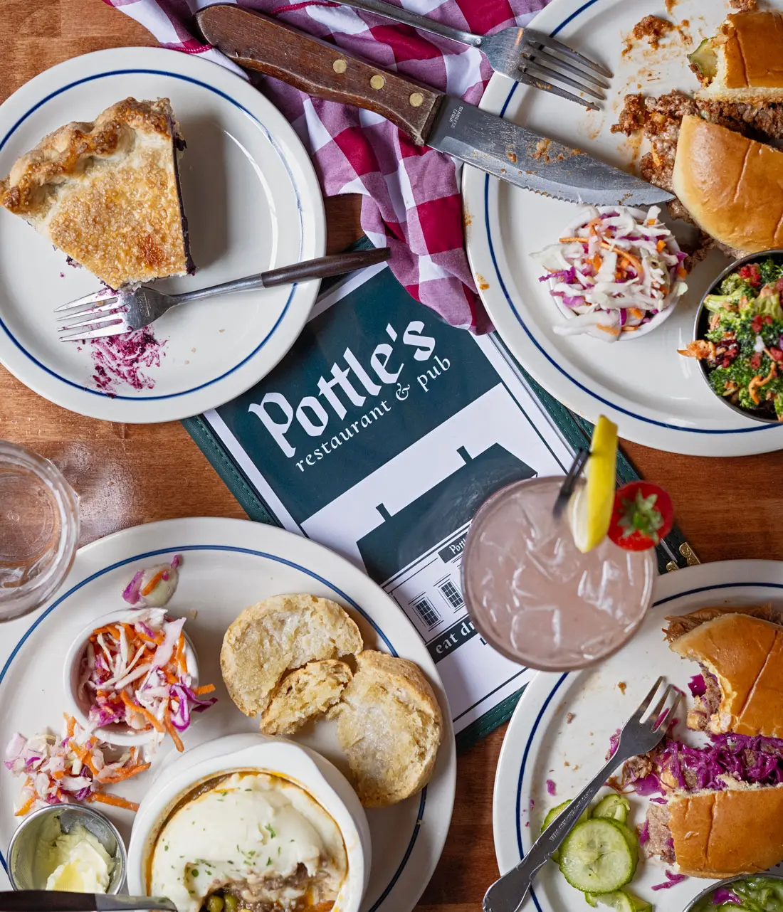 Pottle's menu surrounded by dishes of prepared food