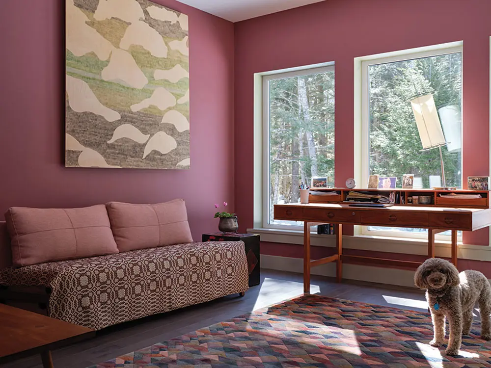 a painting by German artist Friederike Hamann on the mauve walls of the office