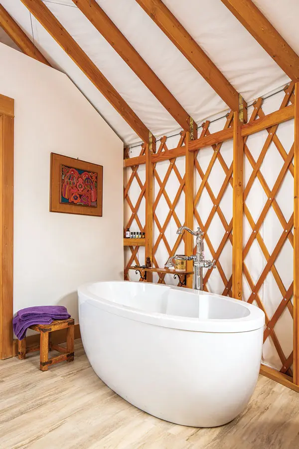 the yurt bathroom is complete with a soaking tub