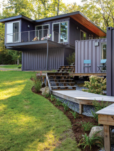 Douglas-fir soffits work with the bold paint job to warm the metal exterior of Liz and Todd Howard's shipping container home