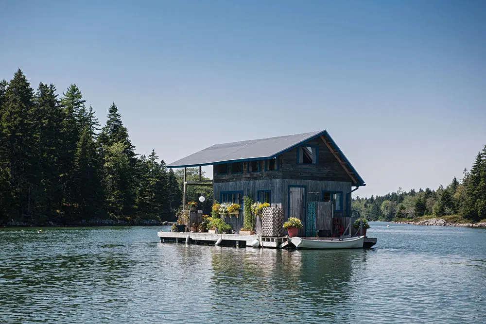 Foy and Louisa Brown’s handbuilt houseboat with a wraparound deck and outdoor shower is a fixture in Vinalhaven’s Perry’s Creek, where it has recently been attracting crowds.
