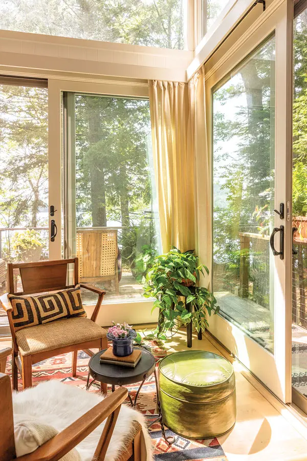 A kilim rug bought from the former owners occupies a guest-bedroom corner, along with a vintage ottoman and chairs and a table from Millar’s great-grandfather’s Houlton ice-cream shop.