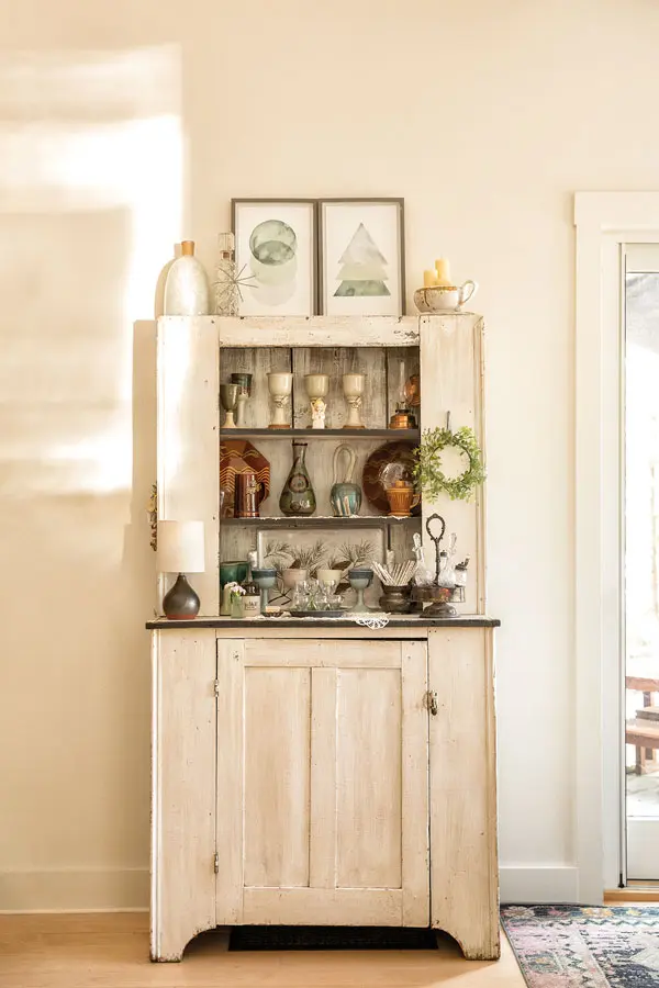 Millar painted a kitchen cupboard that came with the house and turned it into a bar.