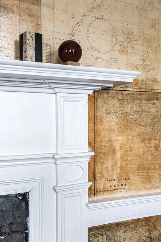 The oval panel and delicate molding profile on this mantel in the sitting room of the Captain Johnson H. Stover Jr. House are characteristic of the Federal style