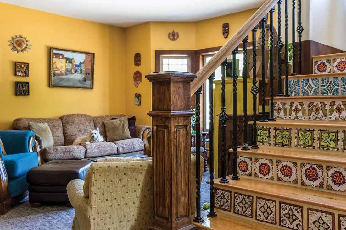 a central staircase decorated with tiles Sarah Sorenson modeled on Mexican pottery