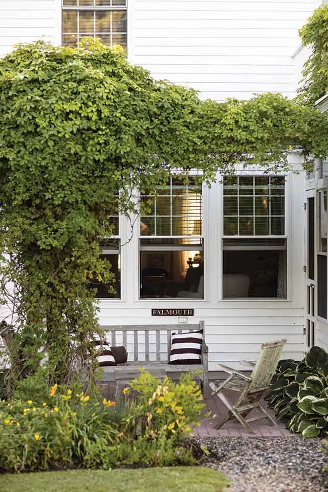 a sitting-area arbor swathed in clematis and honeysuckle