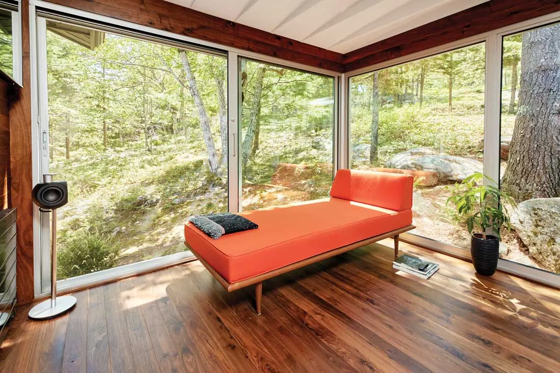 For an MDI Couple, One Renovation Led to Another a glassed-in sanctuary with walnut flooring, and a George Nelson daybed