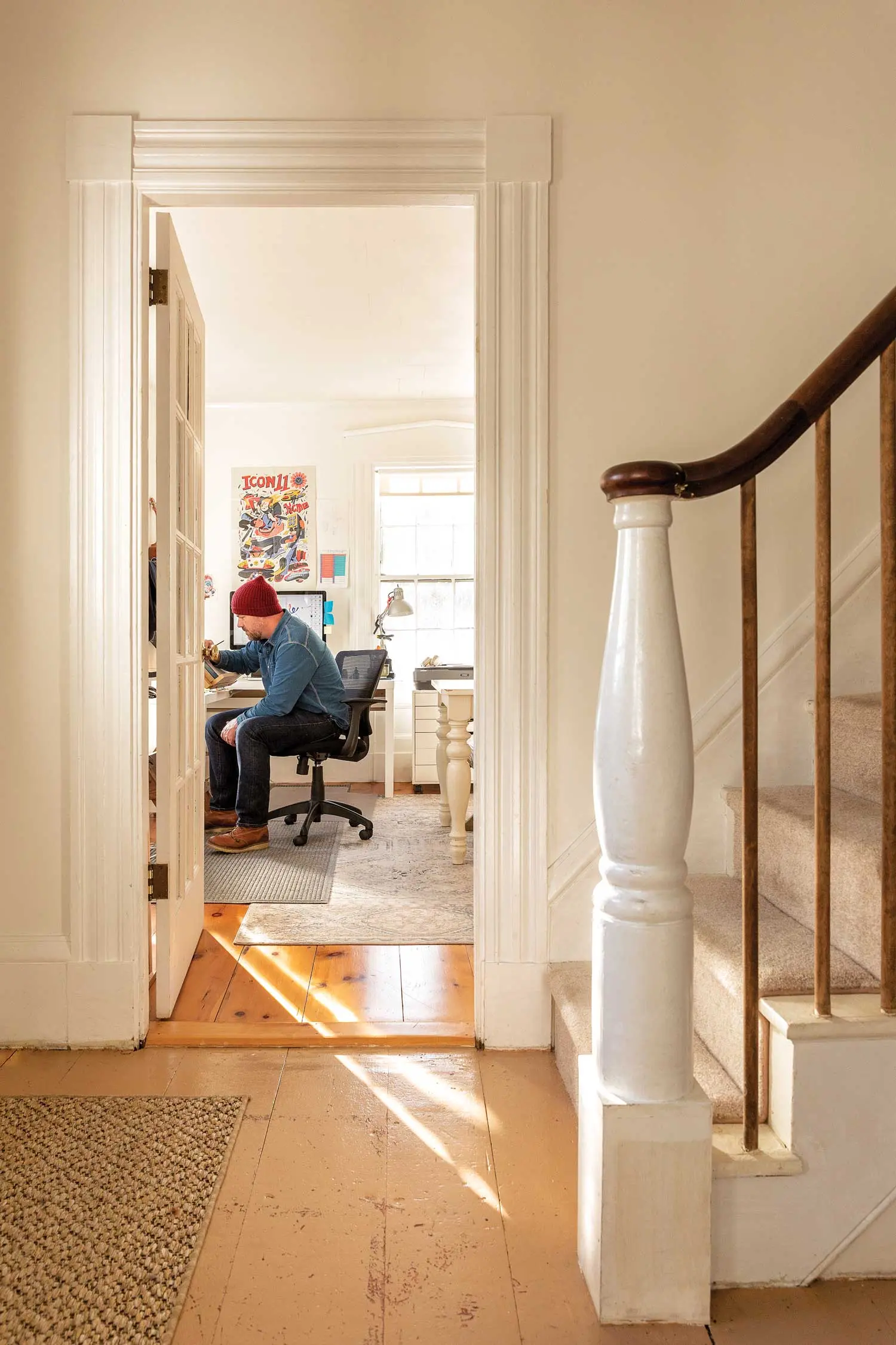 Andrew DeGraff works at a mid-century drawing table in the Waldoboro home he shares with Michelle Provencal