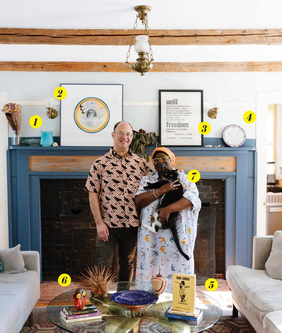Samaa Abdurraqib and Matt Fein with their cat in the their Brunswick living room